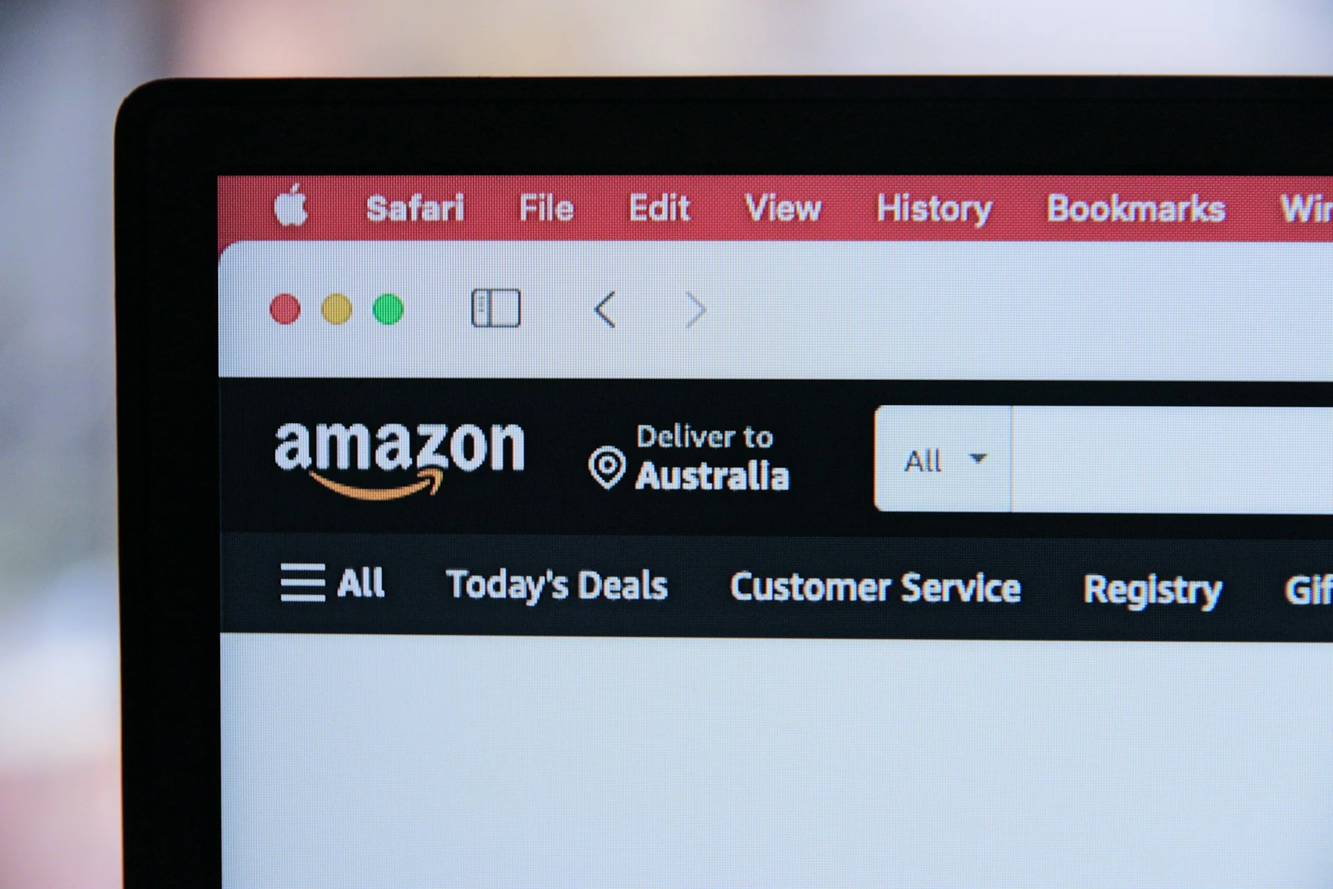 Computer screen with open Amazon website tab with logo.
